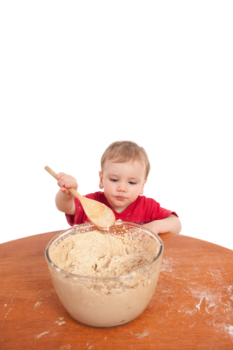 boy stirring cake mixture